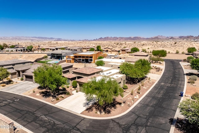 aerial view with a residential view, a mountain view, and a desert view