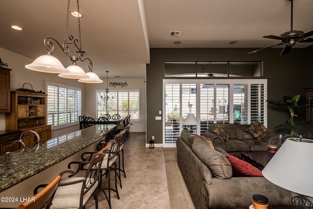 living room featuring recessed lighting, visible vents, baseboards, and ceiling fan