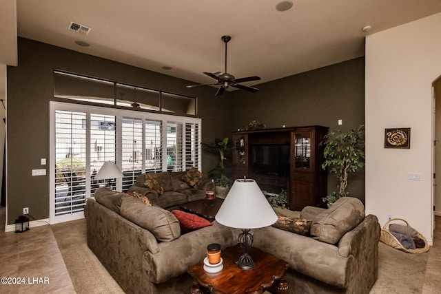 living room featuring visible vents and ceiling fan