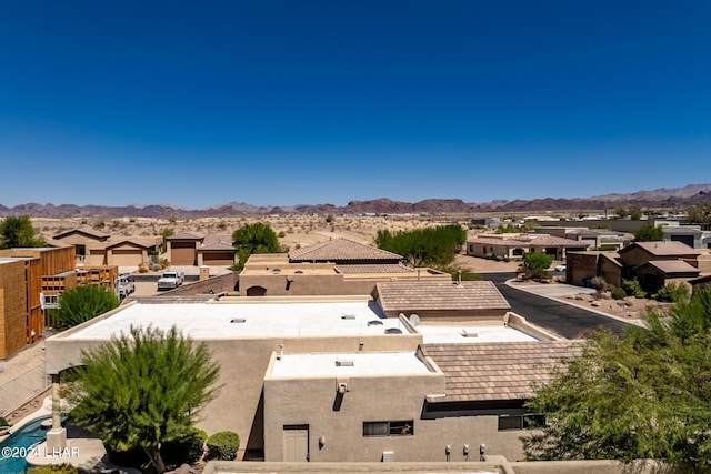 drone / aerial view with a residential view and a mountain view