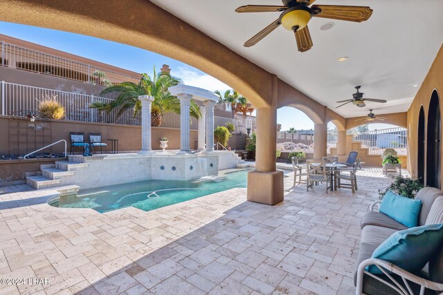 view of pool featuring ceiling fan and a patio