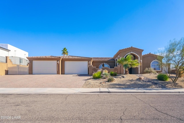 mediterranean / spanish-style house featuring a garage