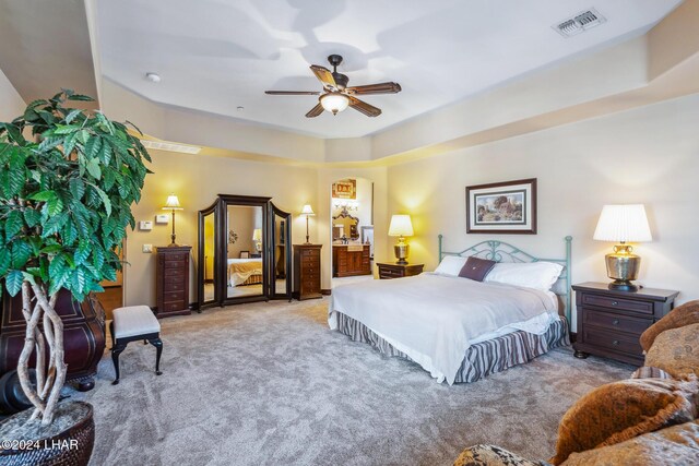 bedroom with light carpet and ceiling fan