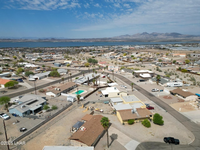 birds eye view of property with a water and mountain view and a residential view