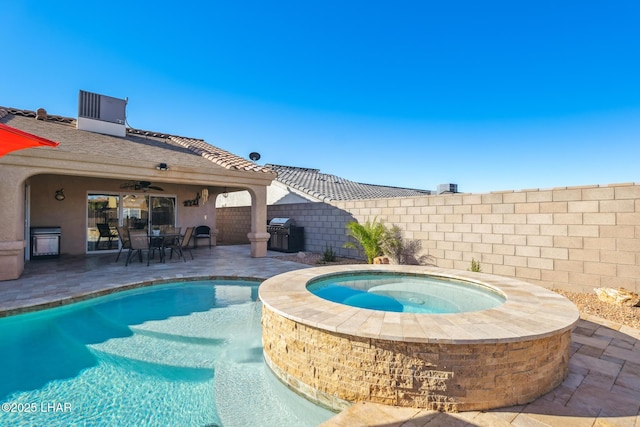 view of pool with a patio area, area for grilling, a fenced backyard, and an in ground hot tub