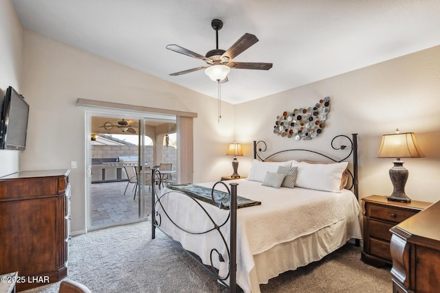 bedroom featuring ceiling fan, access to exterior, carpet flooring, and vaulted ceiling