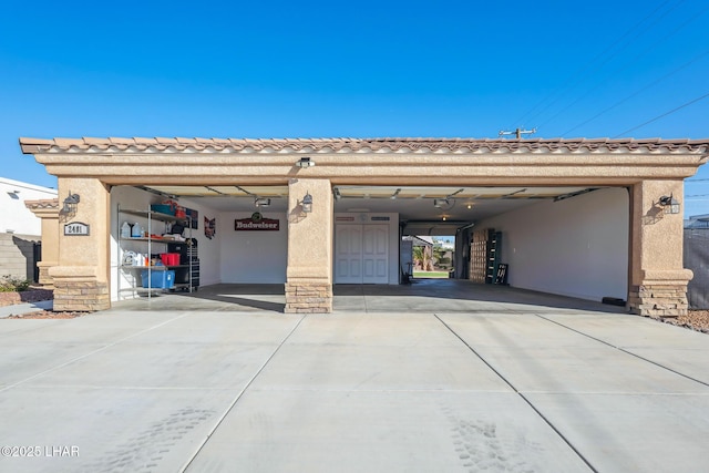 garage with concrete driveway