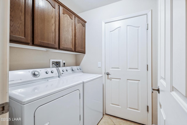 laundry area featuring cabinet space and washer and clothes dryer