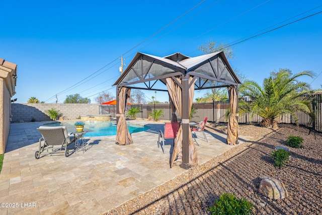 view of patio featuring a gazebo, a fenced in pool, and a fenced backyard