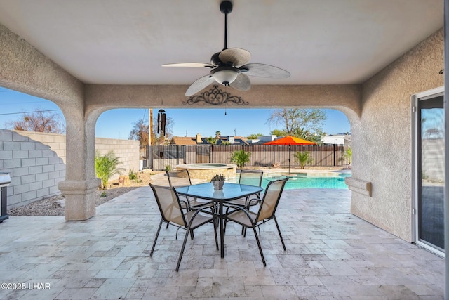 view of patio featuring a ceiling fan, outdoor dining space, a fenced backyard, and a fenced in pool