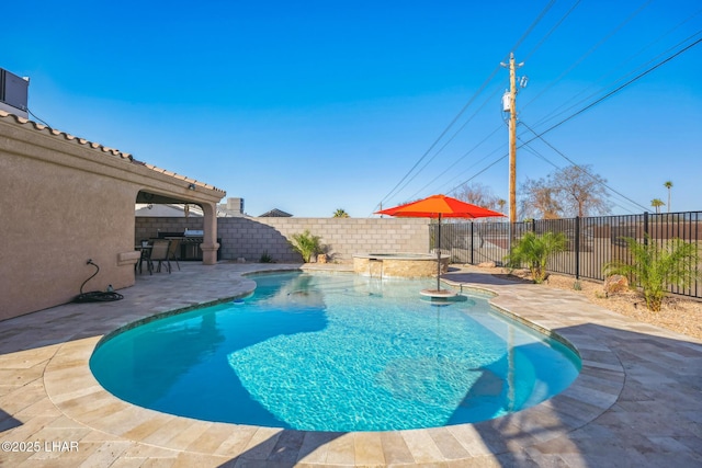 view of pool with a patio, a fenced backyard, and a pool with connected hot tub