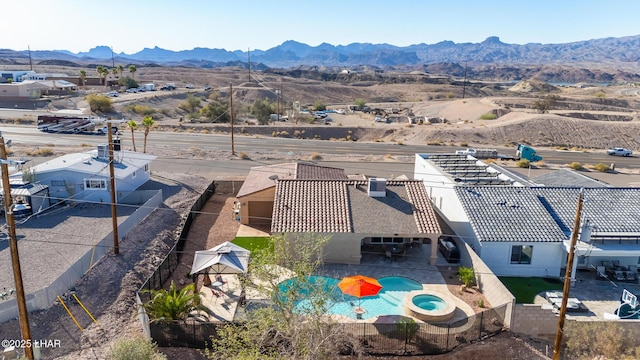 birds eye view of property featuring a mountain view