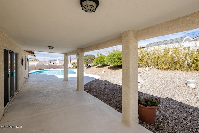 view of patio / terrace featuring fence and a fenced in pool