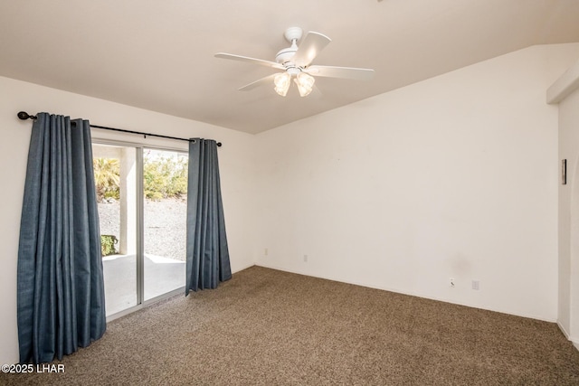 carpeted spare room featuring lofted ceiling and a ceiling fan