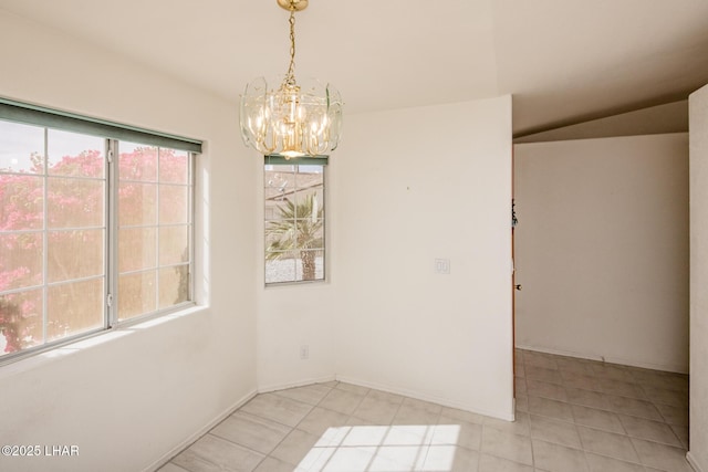 unfurnished room with light tile patterned floors, a chandelier, and baseboards