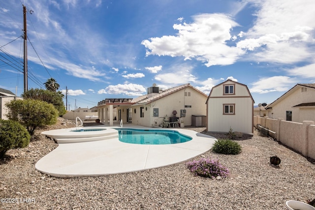 view of pool with a fenced in pool, a fenced backyard, an outbuilding, a storage unit, and a patio area