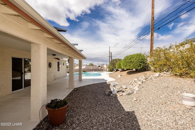 view of yard featuring a patio and a fenced in pool