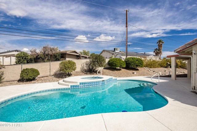 view of swimming pool featuring a fenced in pool, a patio area, a fenced backyard, and an in ground hot tub