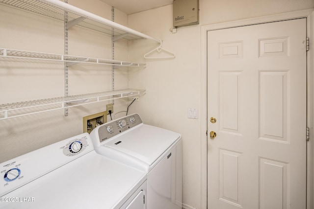 clothes washing area with washing machine and dryer and laundry area