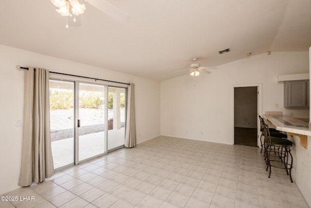 unfurnished living room with lofted ceiling, visible vents, and ceiling fan