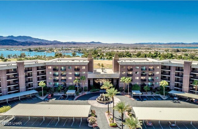 777 Harrah Way Unit 318, Lake Havasu City, AZ 86403 - view of building exterior with a water and mountain view