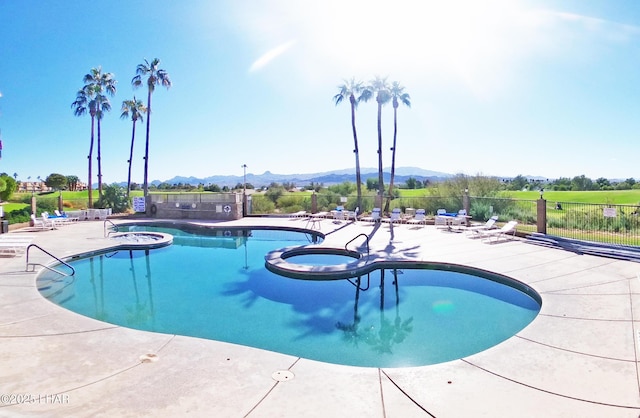 777 Harrah Way Unit 318, Lake Havasu City, AZ 86403 - view of pool with a mountain view, a community hot tub, and a patio area