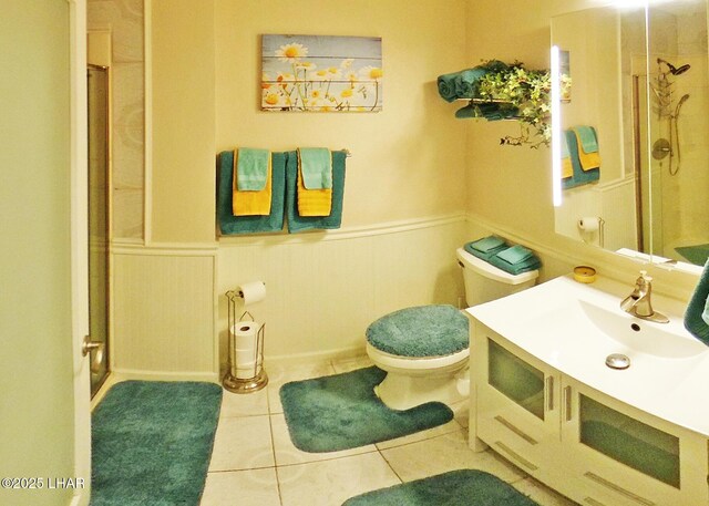 777 Harrah Way Unit 318, Lake Havasu City, AZ 86403 - bathroom with vanity, a shower with shower door, tile patterned floors, and toilet