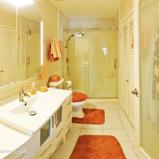777 Harrah Way Unit 318, Lake Havasu City, AZ 86403 - bathroom featuring tile patterned floors, toilet, a shower with door, and vanity
