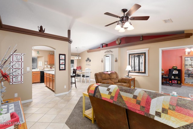 living room featuring ceiling fan with notable chandelier, lofted ceiling, and light tile patterned floors