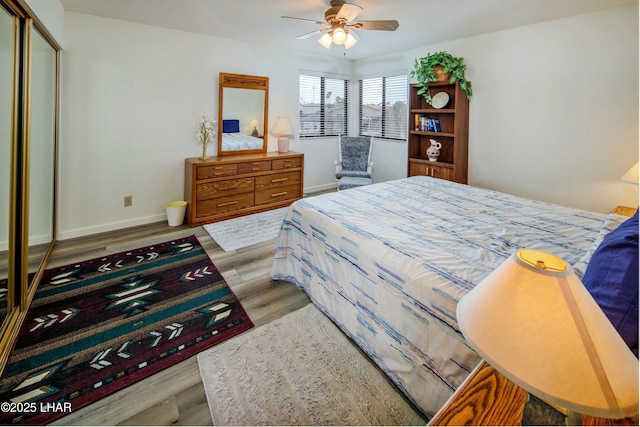 500 S Lake Havasu Ave N Unit A12, Lake Havasu City, AZ 86403 - bedroom featuring wood finished floors, a closet, baseboards, and ceiling fan