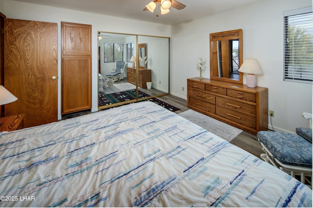 500 S Lake Havasu Ave N Unit A12, Lake Havasu City, AZ 86403 - bedroom featuring baseboards, wood finished floors, a closet, and ceiling fan