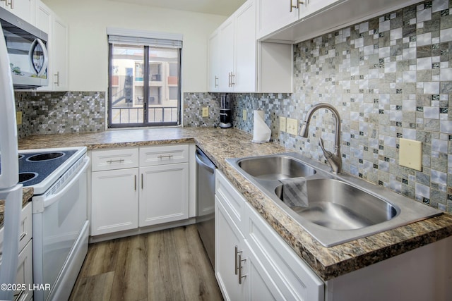 500 S Lake Havasu Ave N Unit A12, Lake Havasu City, AZ 86403 - kitchen featuring backsplash, appliances with stainless steel finishes, a sink, and white cabinets
