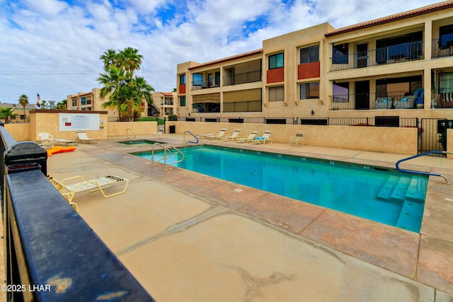 500 S Lake Havasu Ave N Unit A12, Lake Havasu City, AZ 86403 - community pool featuring fence, a hot tub, and a patio