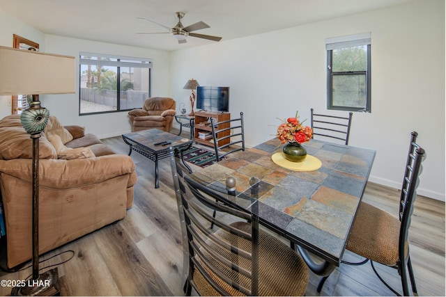 500 S Lake Havasu Ave N Unit A12, Lake Havasu City, AZ 86403 - dining room featuring baseboards, a ceiling fan, and wood finished floors