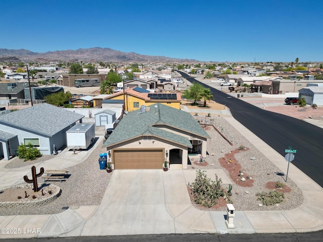 drone / aerial view featuring a mountain view and a residential view