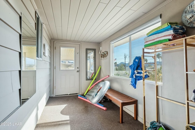 sunroom featuring wooden ceiling