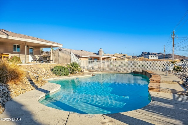 view of pool featuring a patio area, fence, and a fenced in pool