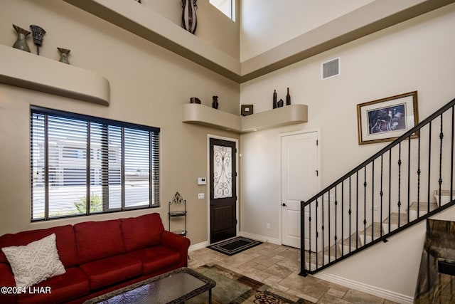 entryway with a towering ceiling