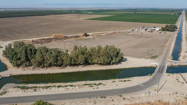 aerial view featuring a rural view and a water view