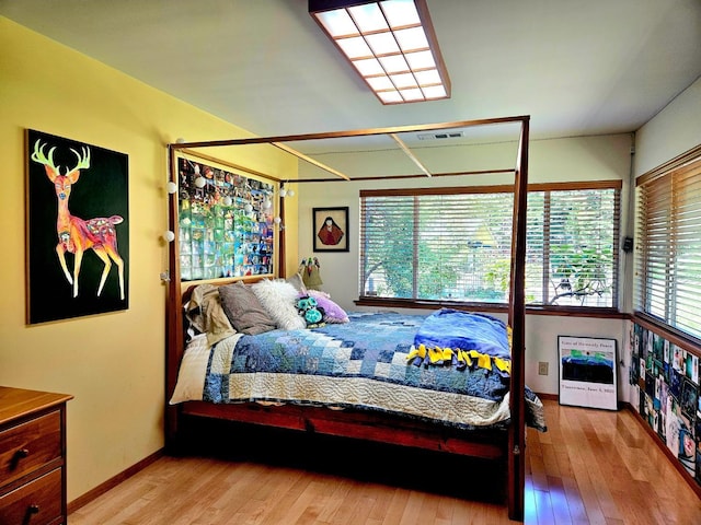 bedroom with light wood-type flooring