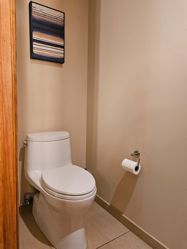 bathroom featuring tile patterned floors and toilet