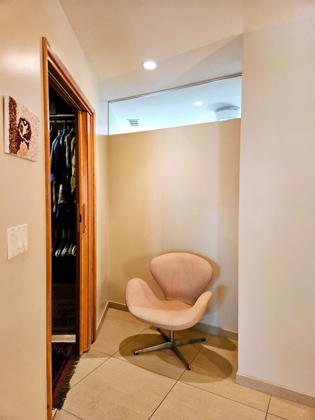 living area featuring light tile patterned floors