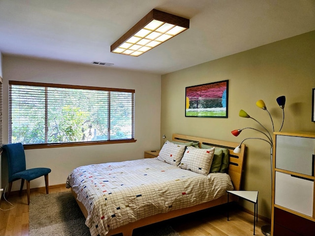 bedroom with light hardwood / wood-style flooring