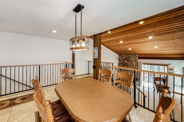 dining area featuring light tile patterned floors and wooden ceiling