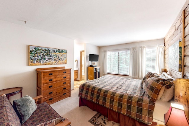 carpeted bedroom with ensuite bathroom