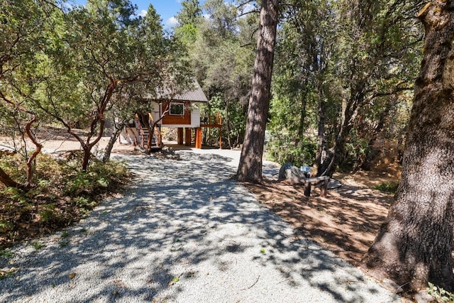 view of property hidden behind natural elements