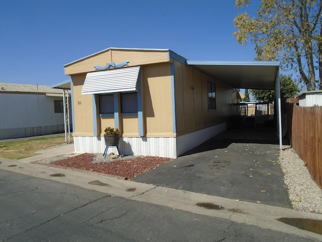 view of property exterior with a carport