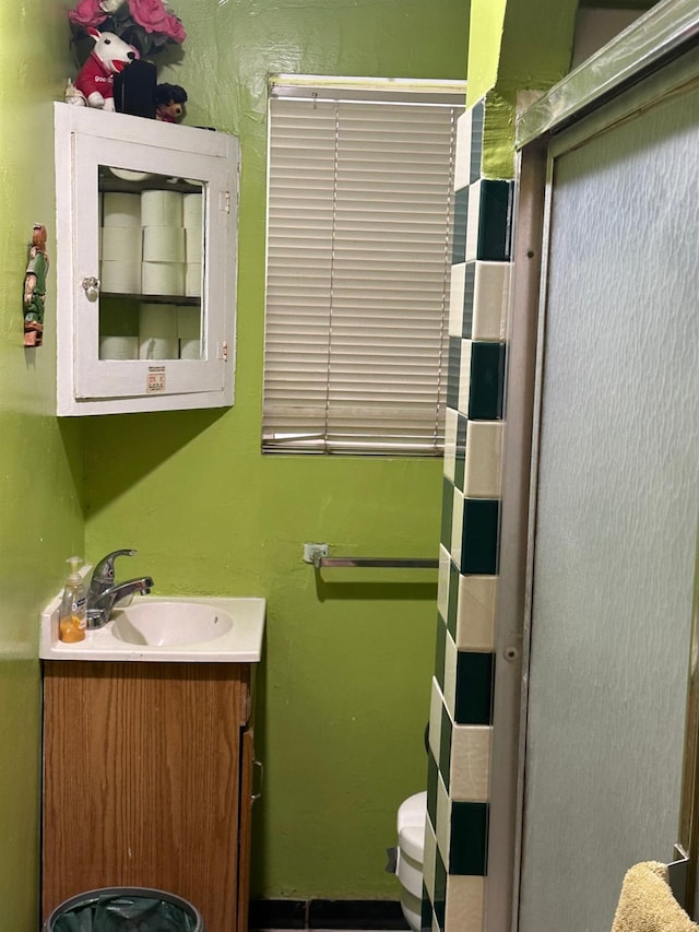 bathroom with toilet and vanity