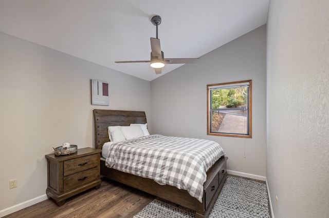 bedroom with hardwood / wood-style flooring, ceiling fan, and lofted ceiling