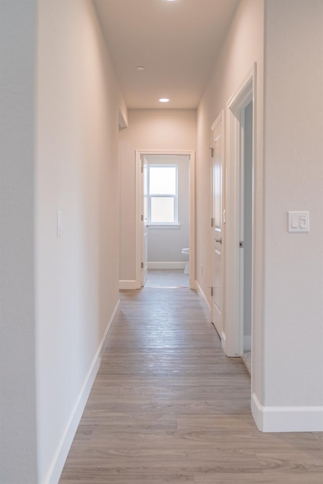 hall with light wood-type flooring